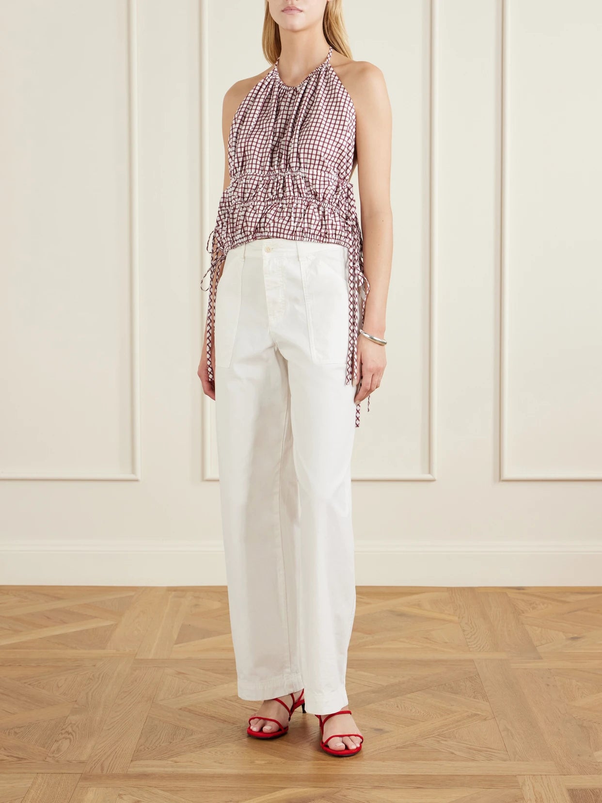 Image of a model wearing Tops. Product name - Lina Checked Cotton Halterneck Top in Burgundy colour by brand - LIBEROWE