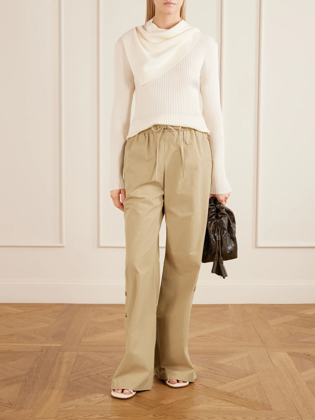 Image of a model wearing Outerwear. Product name - Valiant Scarf-detailed Ribbed-knit Wool Sweater in Cream, Green colour by brand - Zimmermann