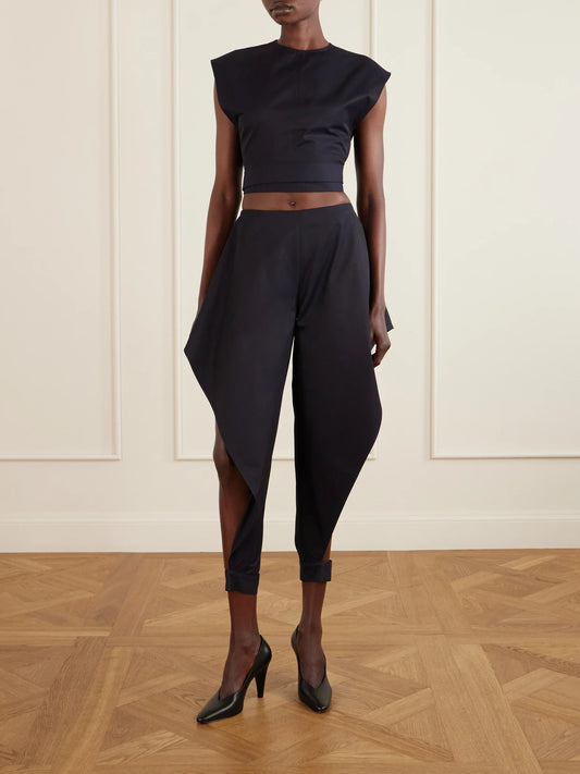 Image of a model wearing Pants. Product name - Triangle Cotton-gabardine Wide-leg Pants in Navy colour by brand - Alaïa