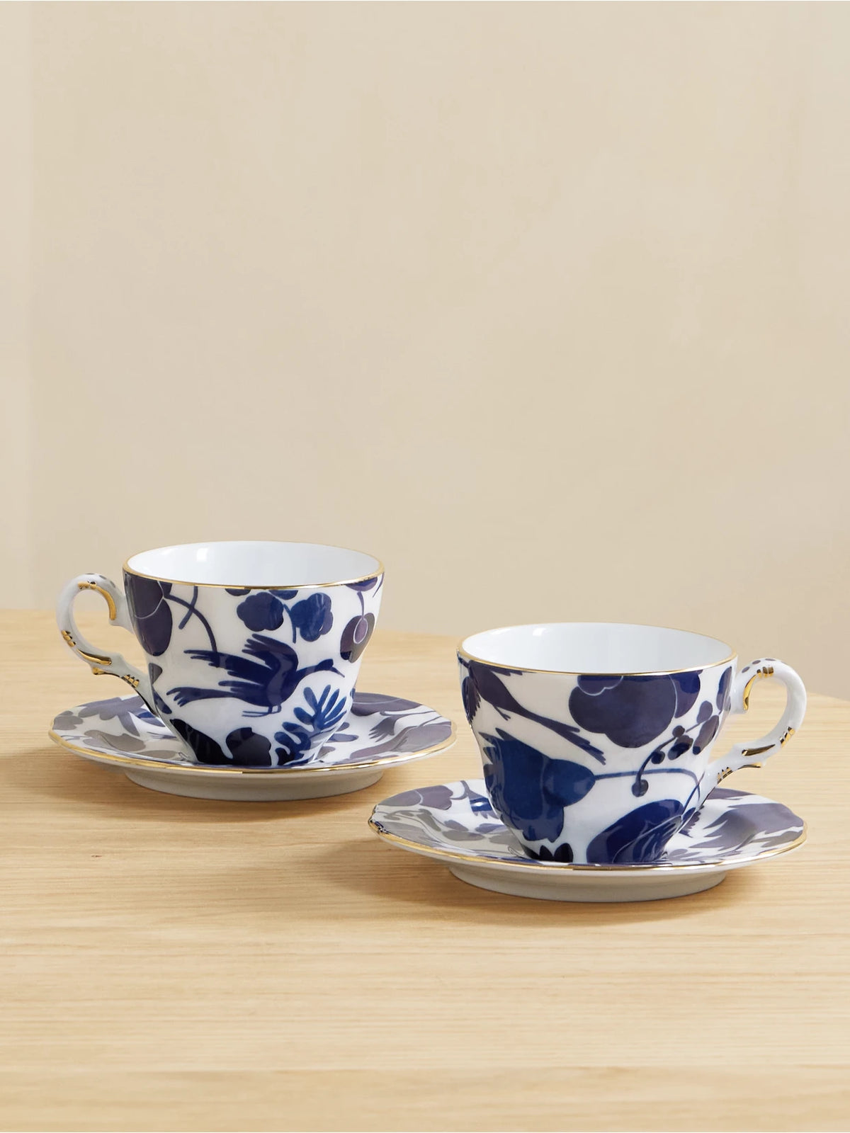Set Of Two Gold-plated Porcelain Teacups And Saucers