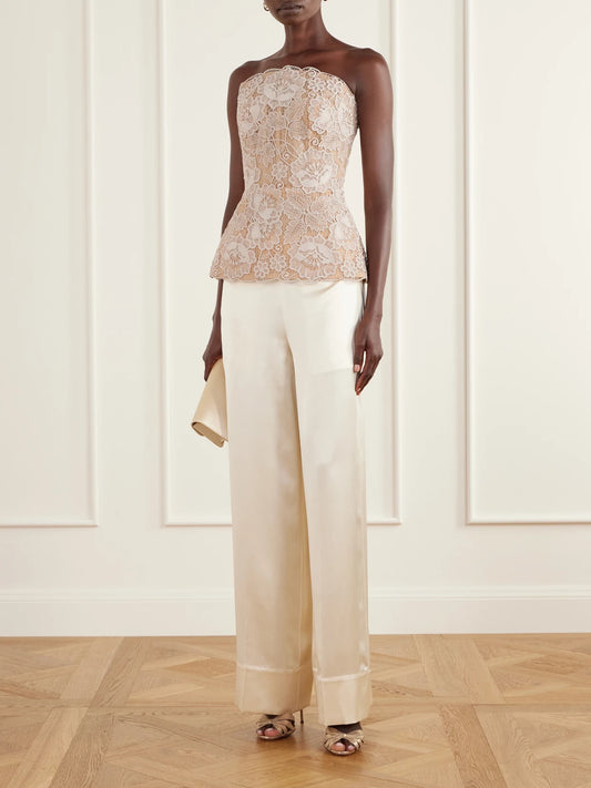 Image of a model wearing Tops. Product name - Scalloped Peplum Guipure Lace Bustier Top in Beige colour by brand - Elie Saab