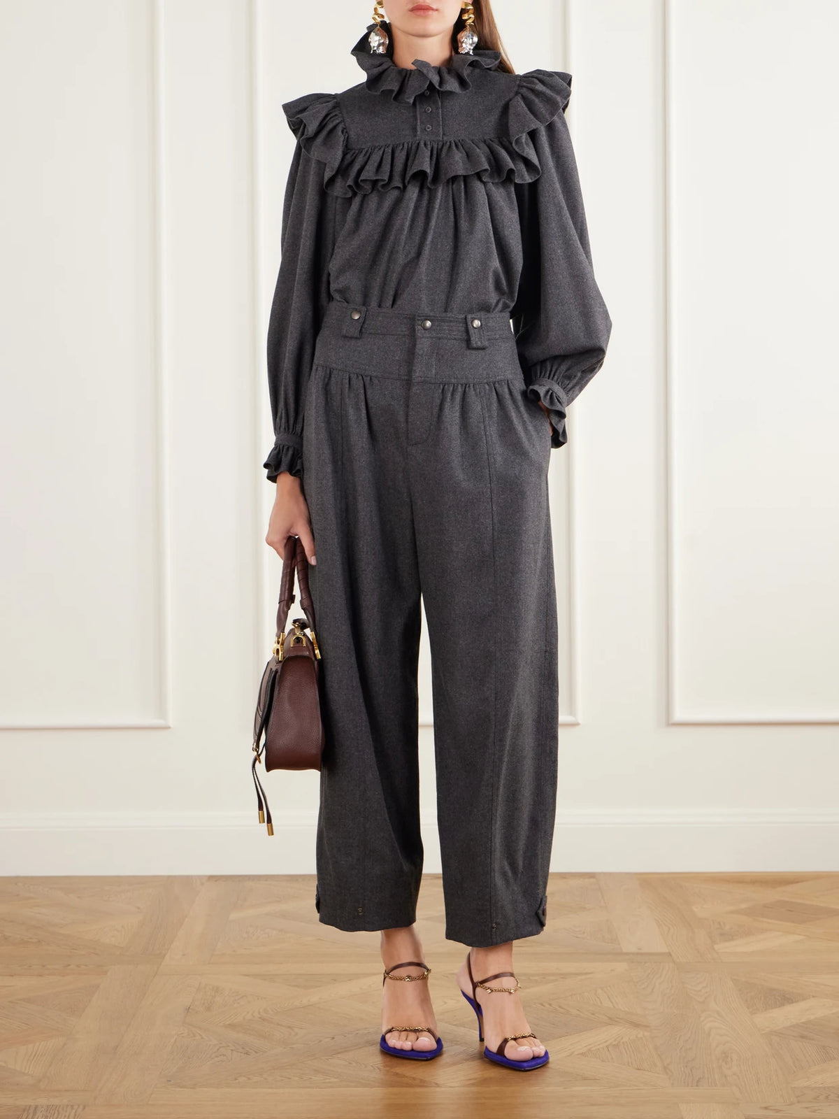 Image of a model wearing Pants. Product name - Plated Flannel Wool And Cashmere-blend Barrel-leg Pants in Dark gray colour by brand - Chloé
