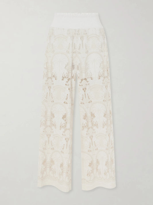 Image of a model wearing Pants. Product name - Speranza Corded Lace Cotton-blend Straight-leg Pants in White colour by brand - Loretta Caponi