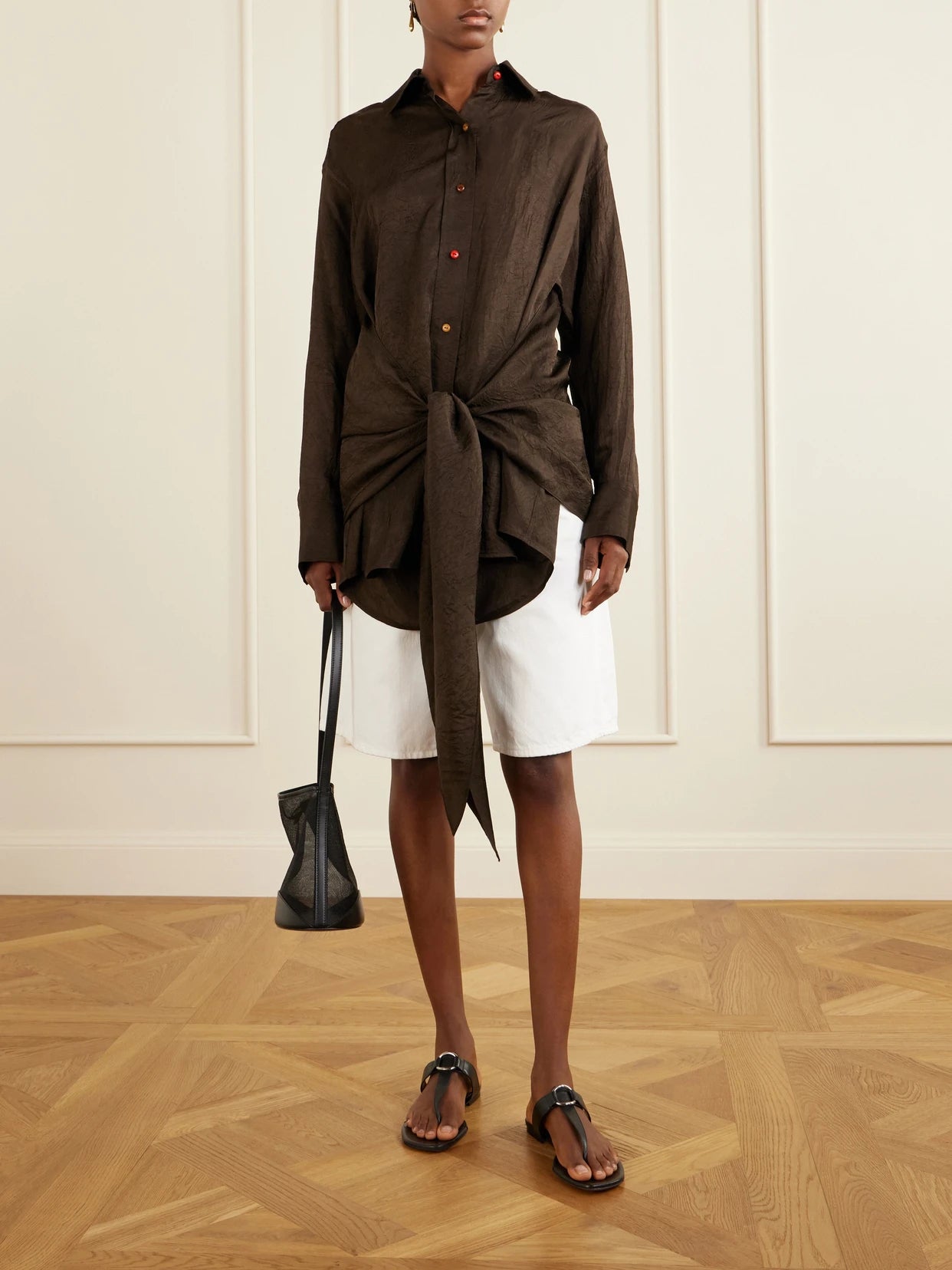 Image of a model wearing Tops. Product name - Arroyo Knotted Crinkled-satin Shirt in Brown colour by brand - OSSOU