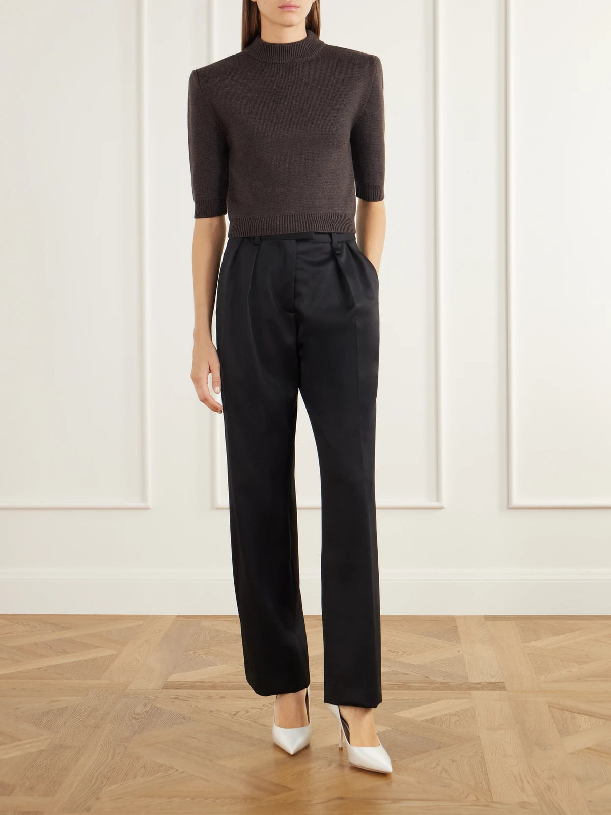 Image of a model wearing Outerwear. Product name - Chavela Cropped Wool Sweater in Brown colour by brand - Willy Chavarria