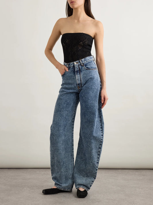 Image of a model wearing Tops. Product name - Strapless Pointelle-knit Bodysuit in Black colour by brand - Alaïa