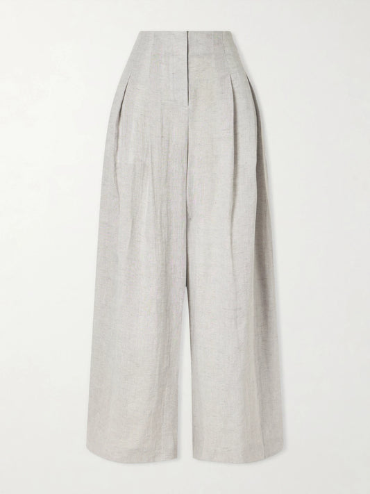Image of a model wearing Pants. Product name - Drew Pleated Wide-leg Hemp Pants in Light gray colour by brand - TWP