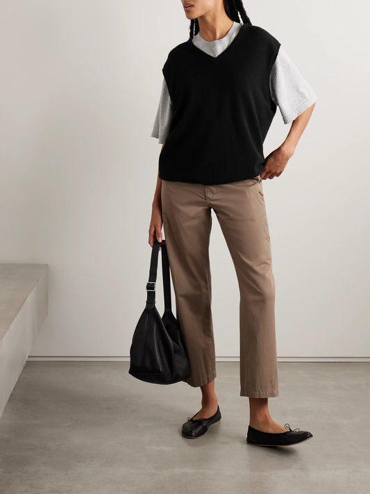 Image of a model wearing Outerwear. Product name - Kossy Cashmere Vest in Black colour by brand - The Row