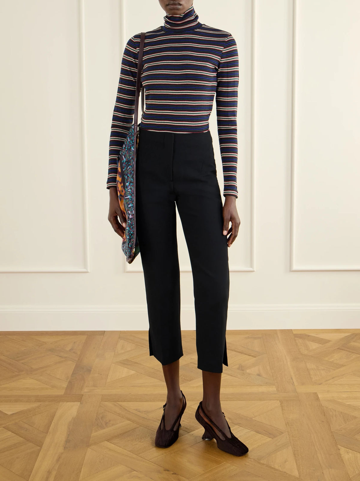 Image of a model wearing Pants. Product name - Crepe Straight-leg Cropped Pants in Black colour by brand - Dries Van Noten