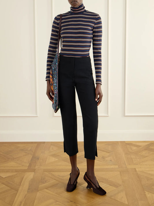 Image of a model wearing Pants. Product name - Crepe Straight-leg Cropped Pants in Black colour by brand - Dries Van Noten
