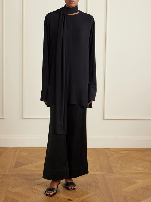 Image of a model wearing Tops. Product name - Scarf-detailed Woven Blouse in Black colour by brand - TOTEME
