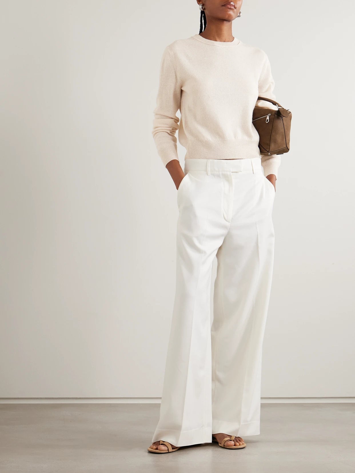 Image of a model wearing Outerwear. Product name - Greer Cashmere Sweater in Beige colour by brand - LISA YANG