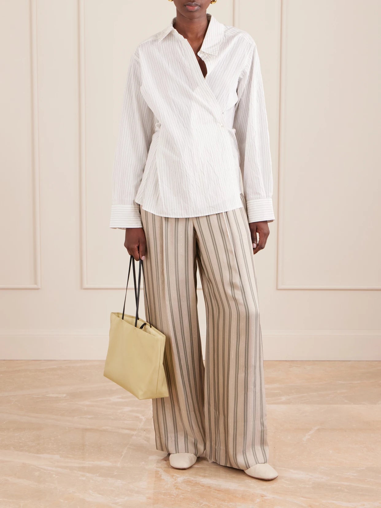 Image of a model wearing Pants. Product name - Hudson St Striped Wide-leg Pants in Ivory colour by brand - TWP