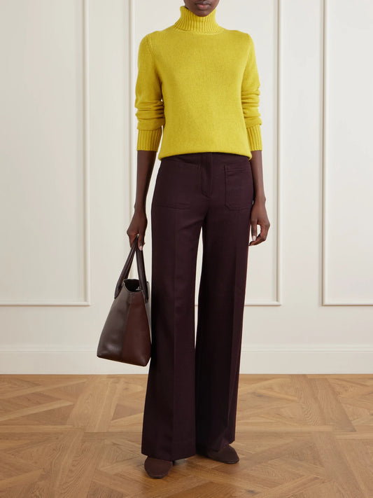 Image of a model wearing Outerwear. Product name - Turtleneck Cashmere Sweater in Mustard colour by brand - Allude