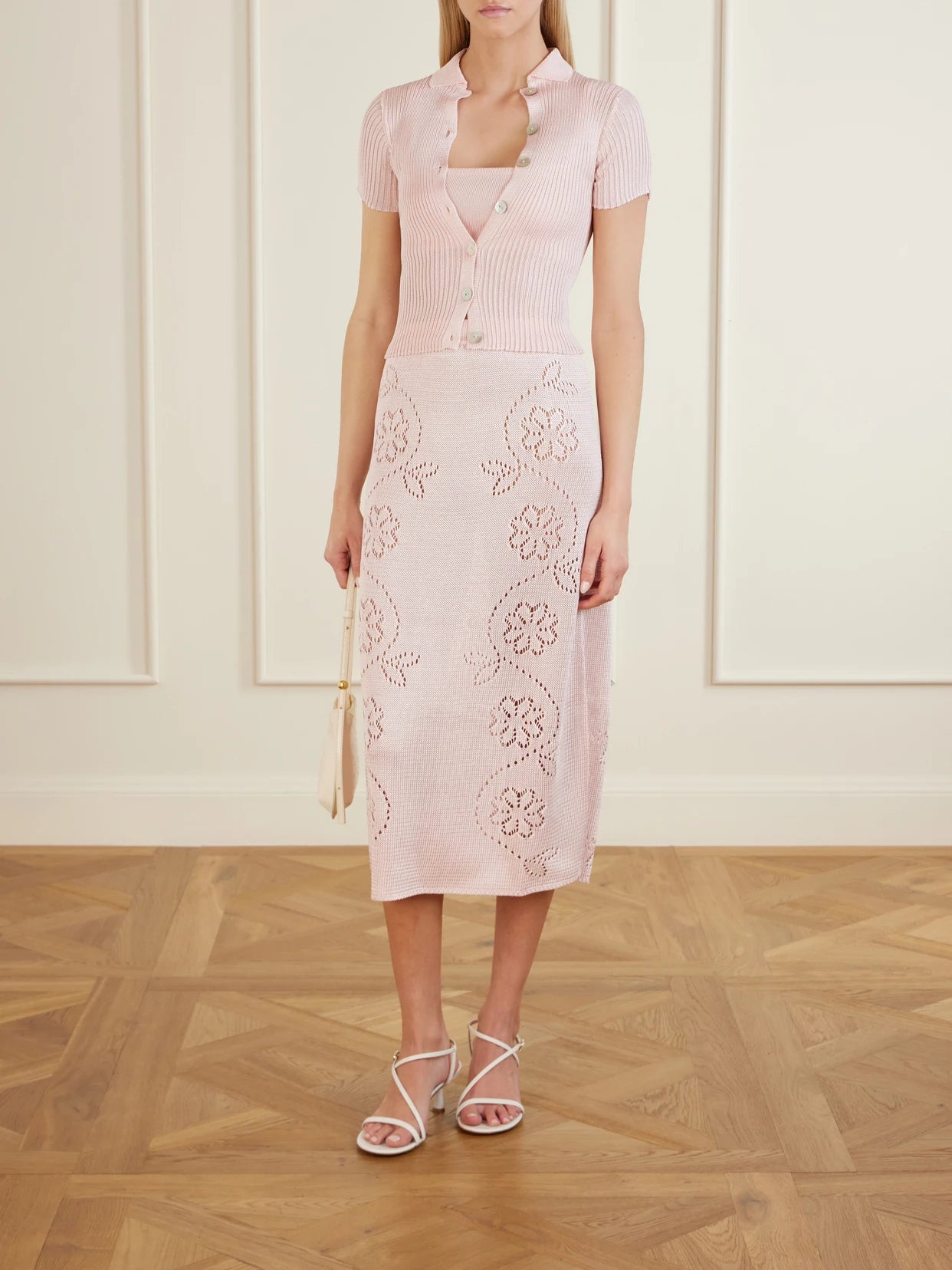 Image of a model wearing Tops. Product name - Stretch-knit Bralette in Pastel pink colour by brand - Calle Del Mar