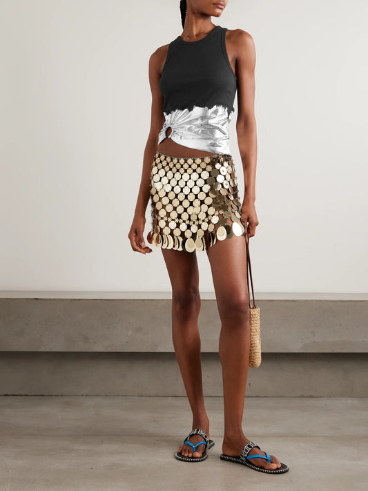 Image of a model wearing Tops. Product name - Embellished Metallic Ribbed Cotton-blend Jersey Tank in Black colour by brand - RABANNE
