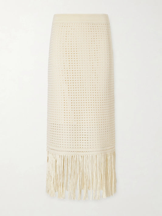 Image of a model wearing Skirts. Product name - Indra Fringed Crocheted Cotton Maxi Skirt in Cream colour by brand - Zimmermann