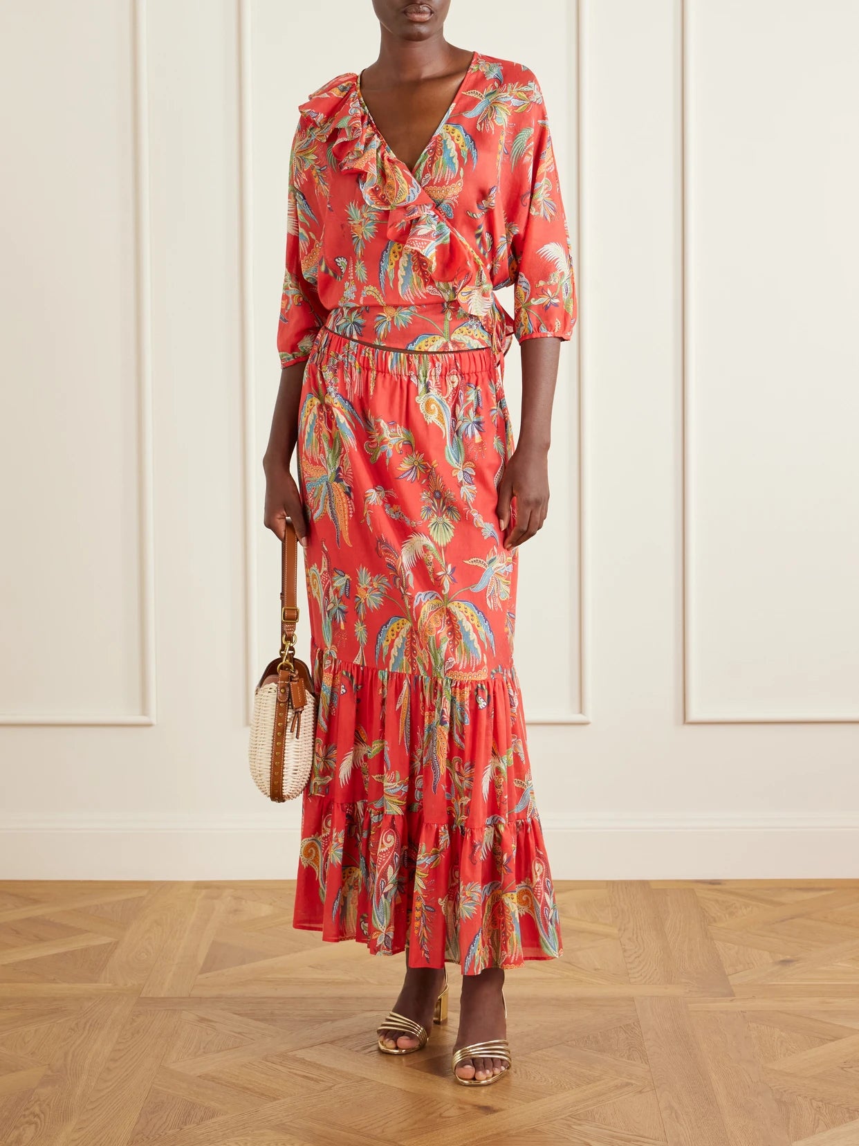 Image of a model wearing Tops. Product name - Ruffled Printed Cotton Blouse in Red colour by brand - Etro
