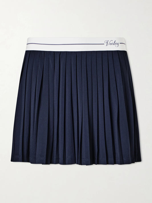 Image of a model wearing Skirts. Product name - Clemency Stretch High-rise Skort in Blue colour by brand - Varley