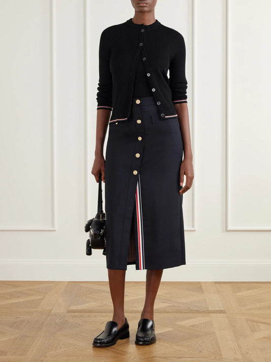 Image of a model wearing Skirts. Product name - Cotton-blend Midi Skirt in Black colour by brand - Thom Browne