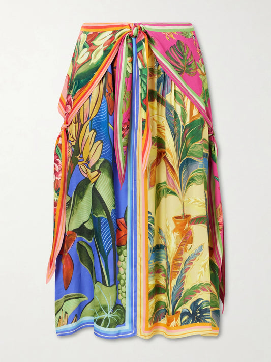 Image of a model wearing Skirts. Product name - Rainbow Summer Printed Satin Midi Skirt in Green colour by brand - Farm Rio