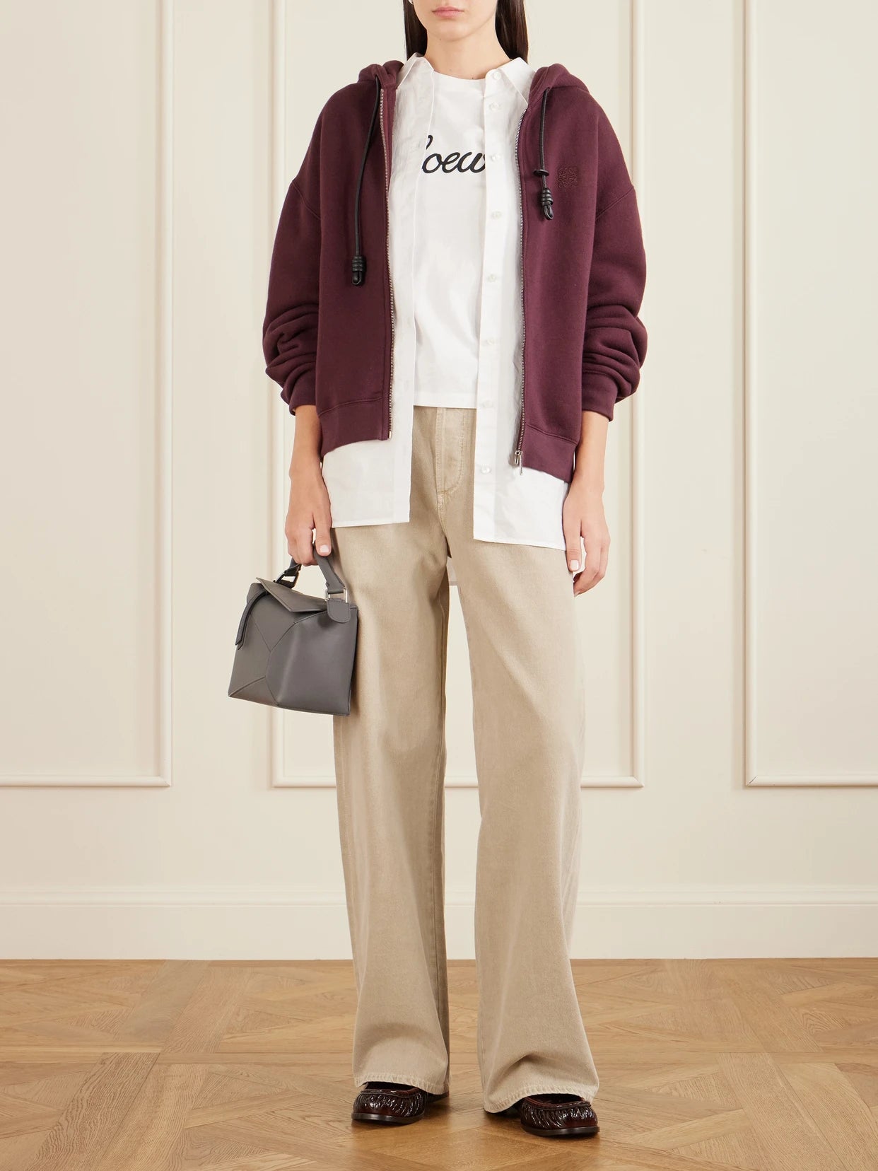 Image of a model wearing Tops. Product name - Embroidered Cotton-jersey T-shirt in White colour by brand - LOEWE
