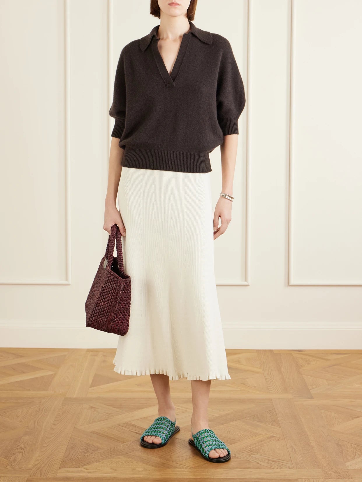 Image of a model wearing Outerwear. Product name - Vella Cashmere Polo Sweater in Brown colour by brand - Proenza Schouler