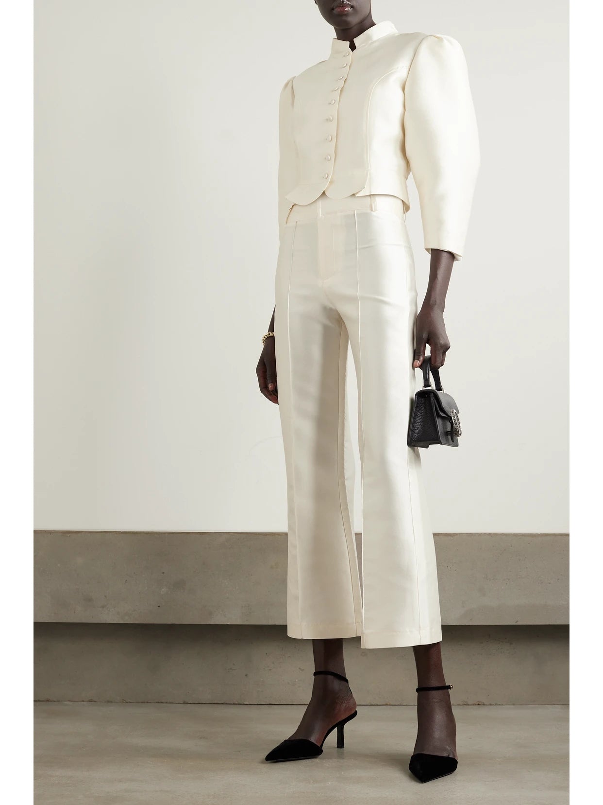Image of a model wearing Pants. Product name - Yoshitomo Pleated Faille Wide-leg Pants in White colour by brand - DESTREE