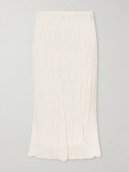 Image of a model wearing Skirts. Product name - Crinkled Metallic Cotton-blend Midi Skirt in Ecru colour by brand - RÓHE