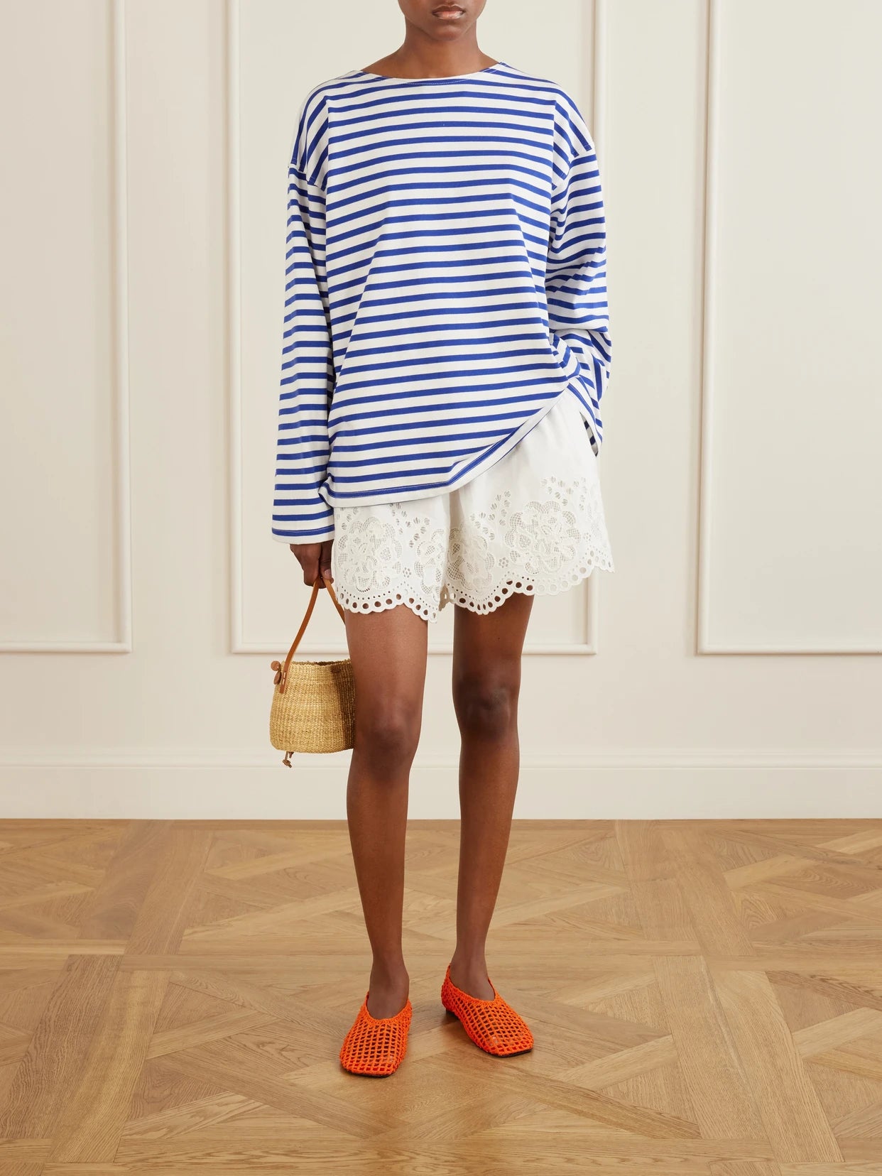 Image of a model wearing Shorts. Product name - Gardener Embroidered Cotton And Linen-blend Shorts in White colour by brand - Sea