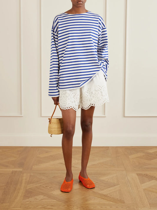 Image of a model wearing Shorts. Product name - Gardener Embroidered Cotton And Linen-blend Shorts in White colour by brand - Sea