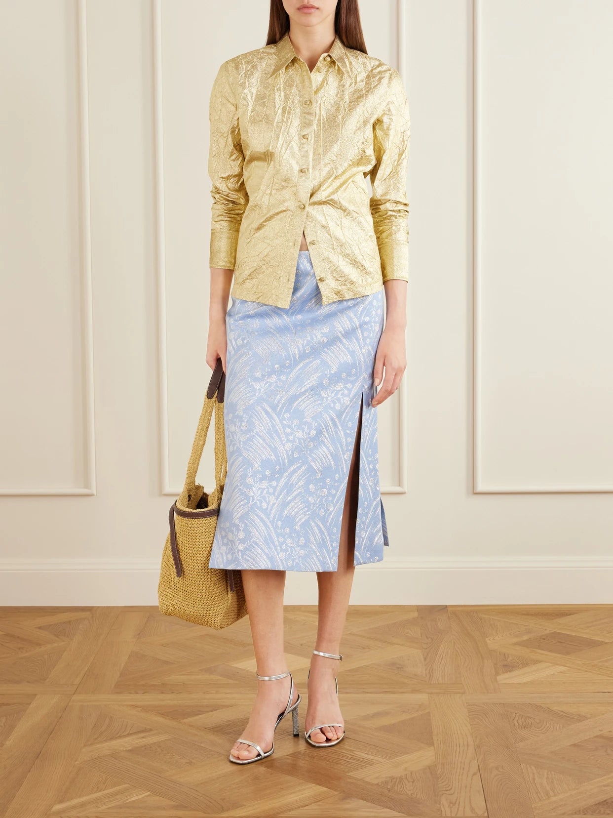 Image of a model wearing Skirts. Product name - Metallic Jacquard-knit Midi Skirt in Blue colour by brand - Tory Burch