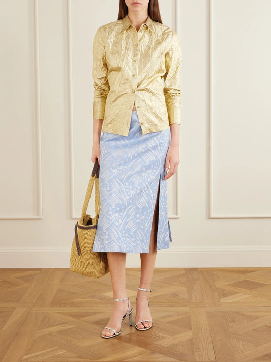 Image of a model wearing Skirts. Product name - Metallic Jacquard-knit Midi Skirt in Blue colour by brand - Tory Burch
