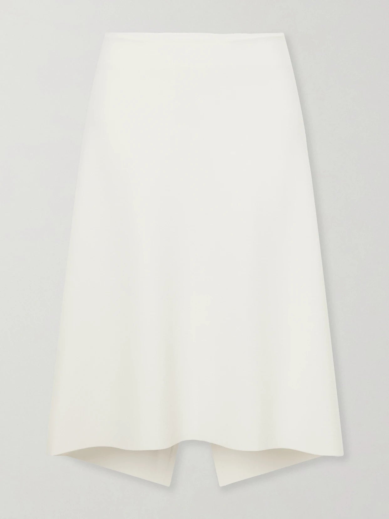 Image of a model wearing Skirts. Product name - Jersey Midi Skirt in White colour by brand - TOTEME