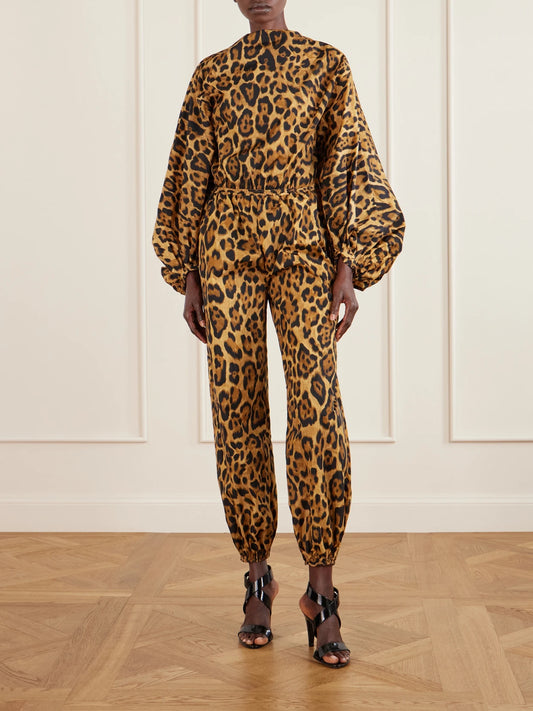 Image of a model wearing Tops. Product name - Leopard-print Shell Bodysuit in Leopard print colour by brand - Alaïa