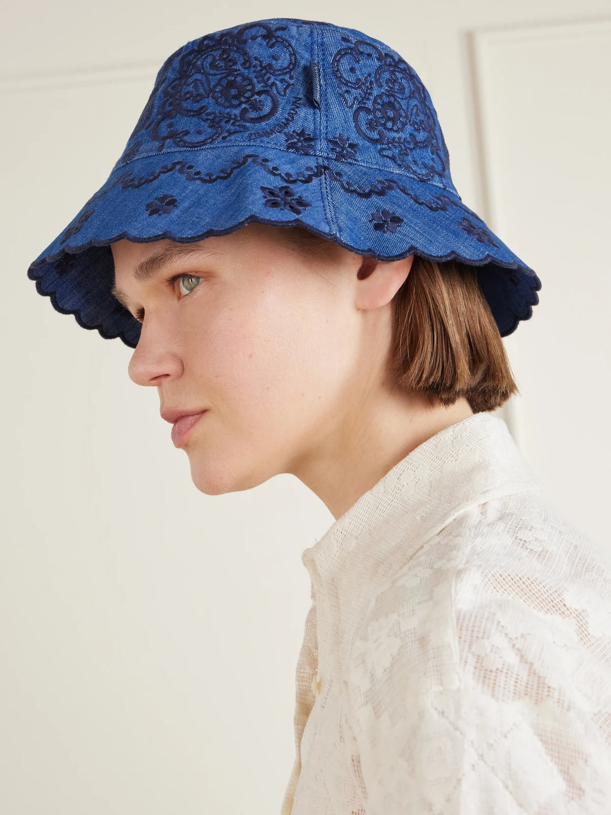 Image of Hats. Product name - Embroidered Denim Bucket Hat in Mid denim colour by brand - Zimmermann