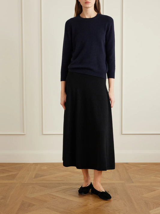 Image of a model wearing Skirts. Product name - Masini Cashmere-blend Midi Skirt in Black colour by brand - The Row
