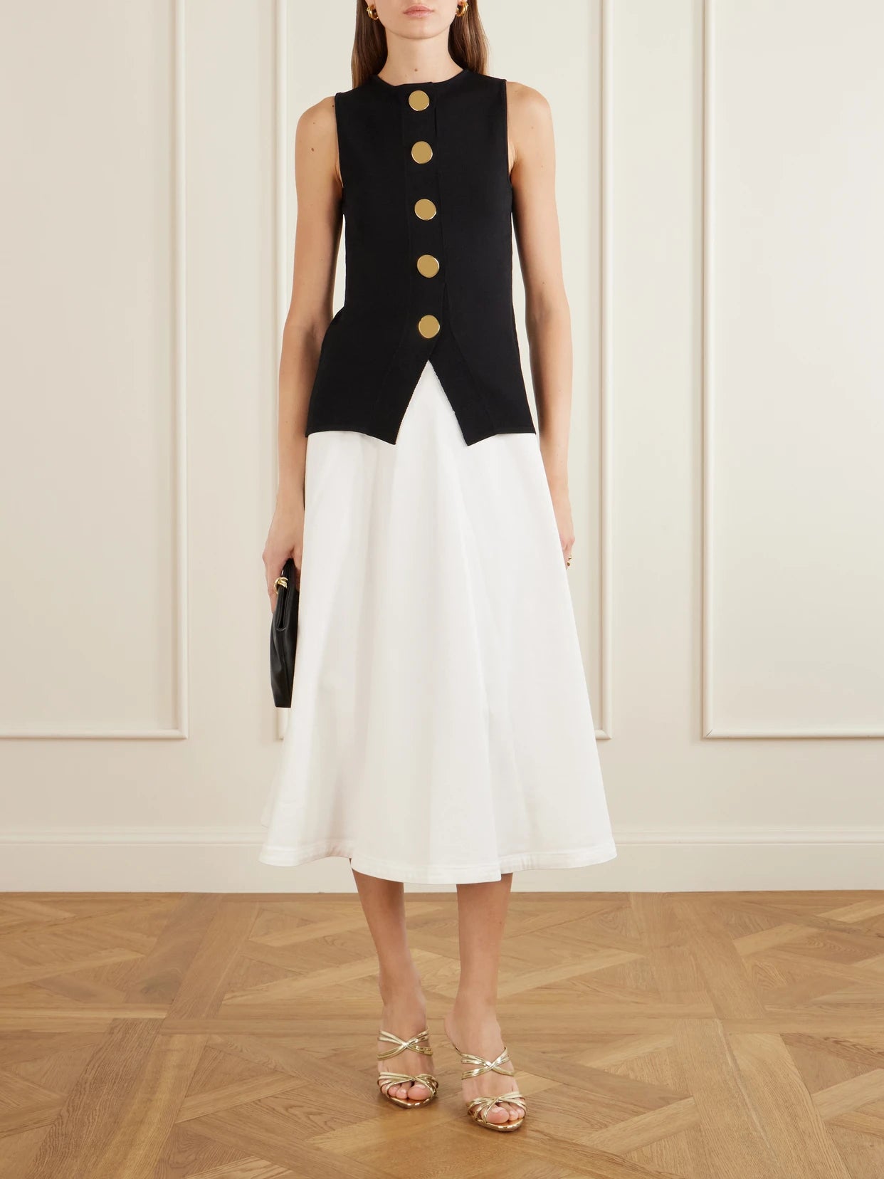 Image of a model wearing Skirts. Product name - Varda Paneled Cotton-blend Midi Skirt in White colour by brand - Altuzarra