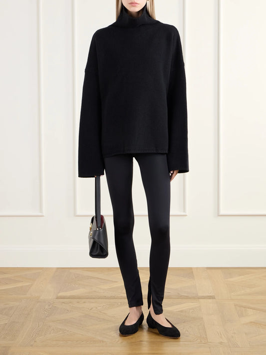 Image of a model wearing Outerwear. Product name - Amie Merino Wool And Cashmere-blend Turtleneck Sweater in Black colour by brand - Almada