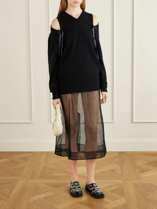 Image of a model wearing Skirts. Product name - Organza Midi Skirt in Black colour by brand - Simone Rocha