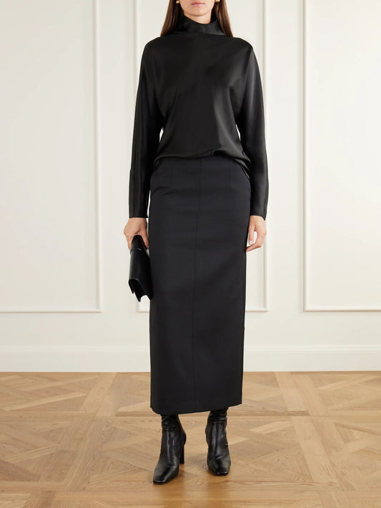 Image of a model wearing Skirts. Product name - Bay Twill Midi Skirt in Black colour by brand - Almada