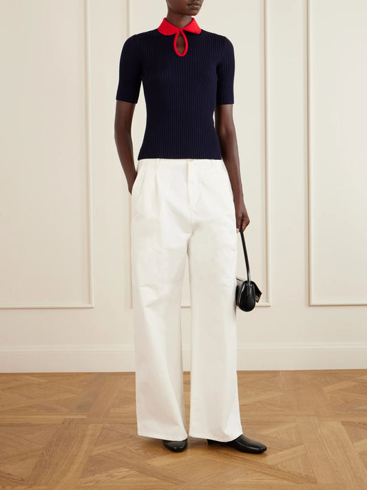 Image of a model wearing Outerwear. Product name - Two-tone Ribbed Wool Polo Shirt in Navy colour by brand - Jil Sander