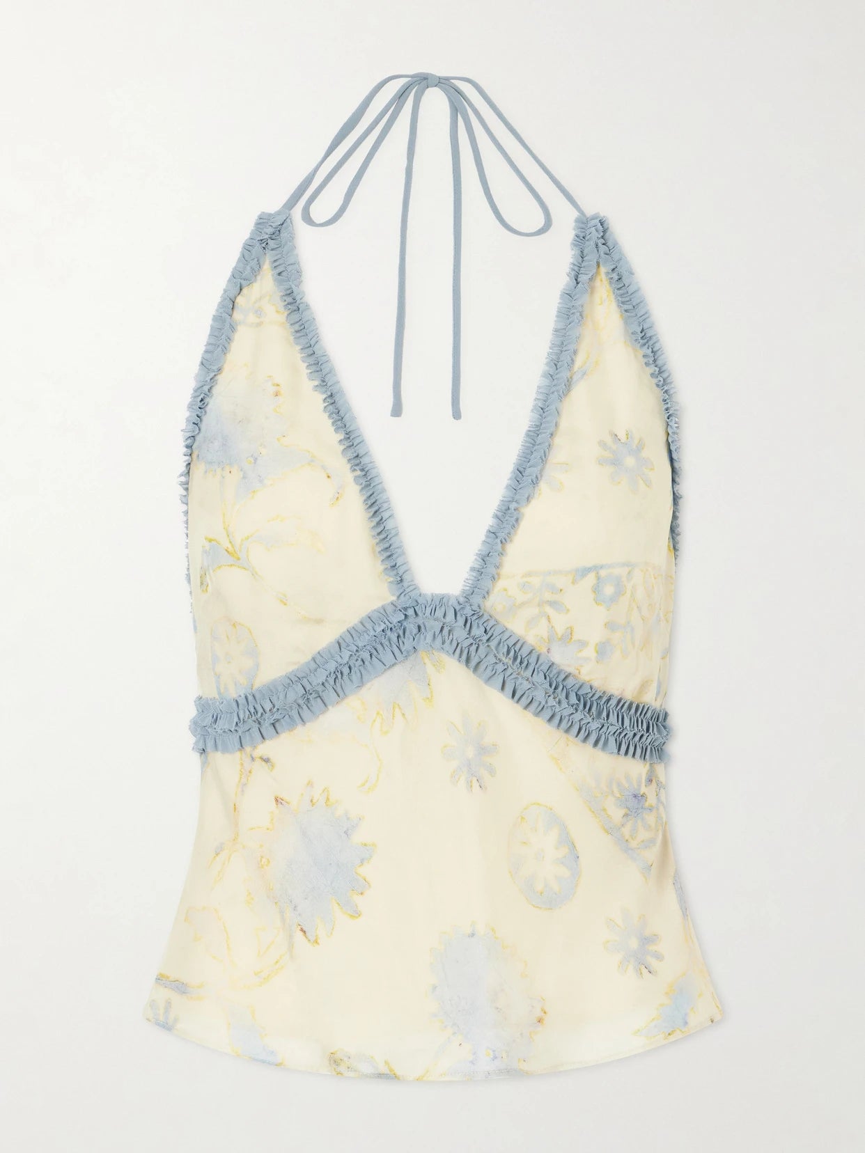 Image of a model wearing Tops. Product name - Cecile Ruffled Printed Chiffon Halter Top in Cream colour by brand - SIR.