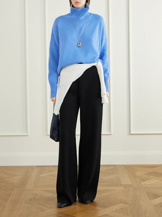 Image of a model wearing Outerwear. Product name - Hiedi Cashmere Turtleneck Sweater in Blue colour by brand - LISA YANG