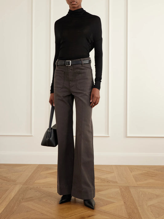 Image of a model wearing Tops. Product name - Gathered Stretch-jersey Blouse in Black colour by brand - Victoria Beckham