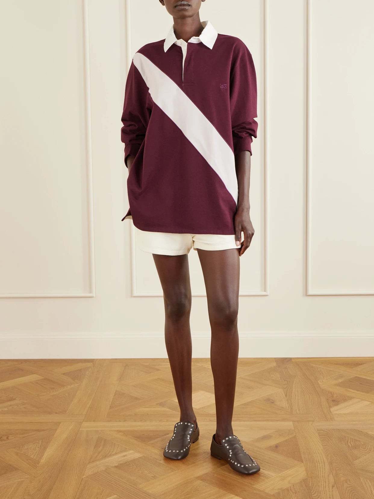 Image of a model wearing Tops. Product name - Prism Cotton-jersey Polo Shirt in Merlot colour by brand - Wales Bonner