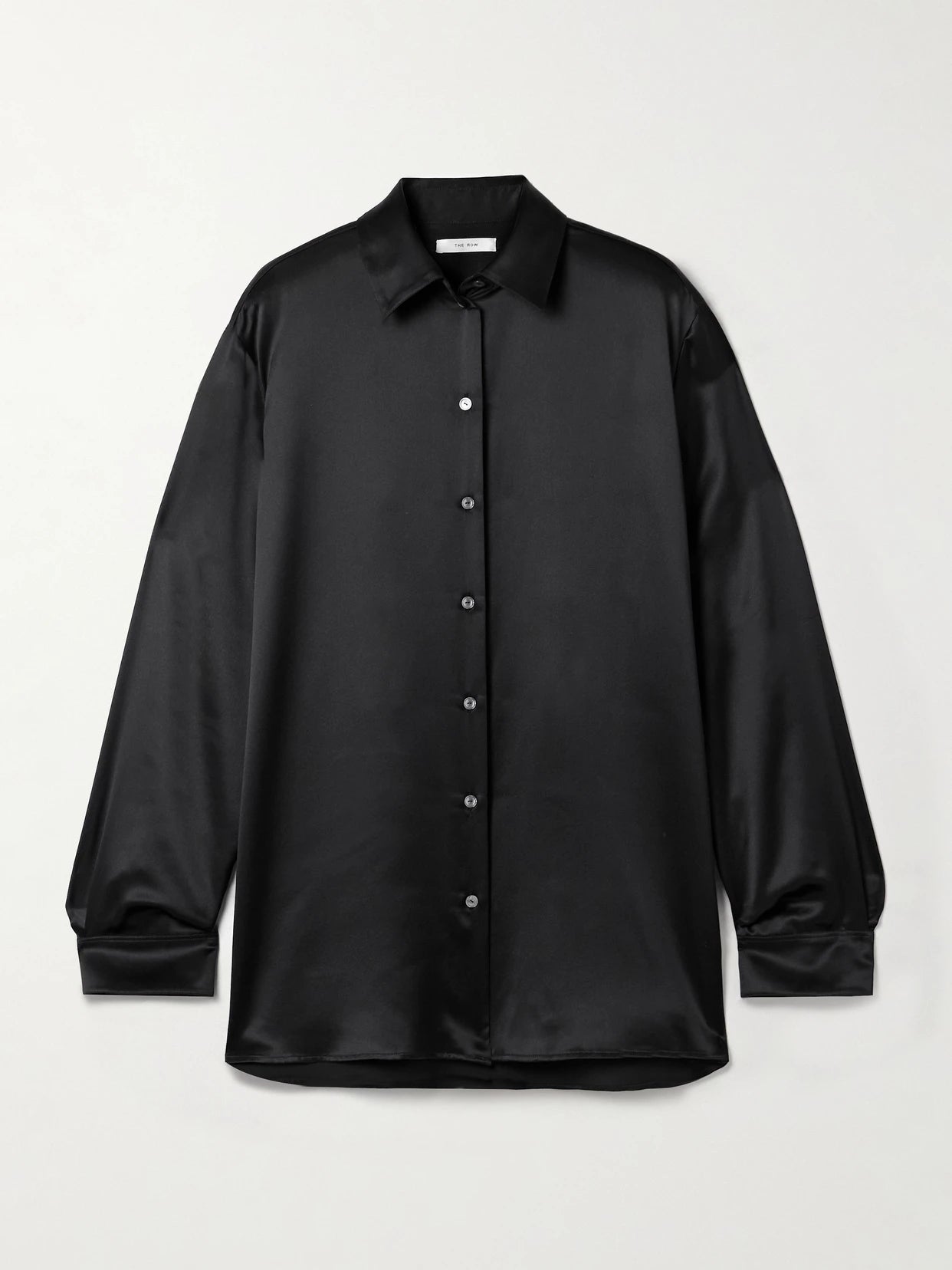 Image of a model wearing Tops. Product name - Sisilia Oversized Silk-satin Shirt in Black colour by brand - The Row
