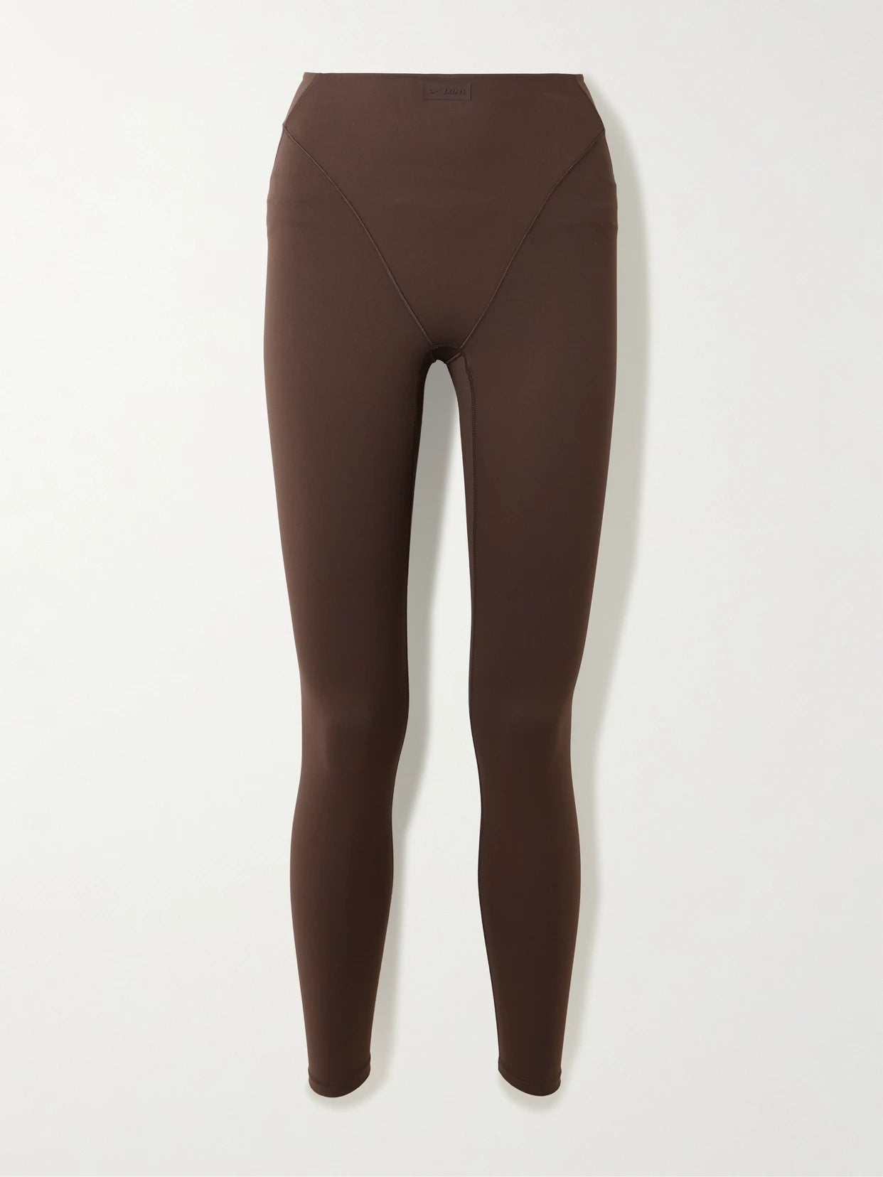 Image of Sleepwear & Loungewear. Product name - + Nike V-line 26" Leggings - Dark Sepia in Brown colour by brand - SKIMS