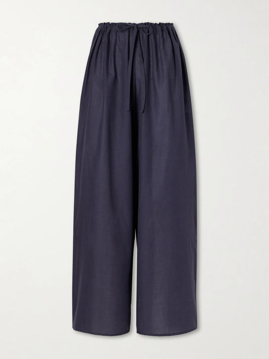 Image of a model wearing Pants. Product name - The Pantaloons Cotton-poplin Wide-leg Pants in Navy colour by brand - Les Vacances D'Irina