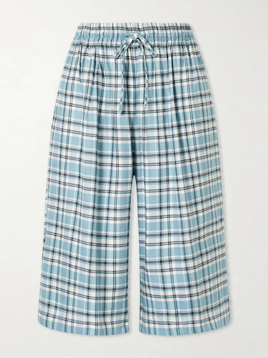Image of a model wearing Shorts. Product name - Embroidered Checked Flannel Shorts in Blue colour by brand - Acne Studios